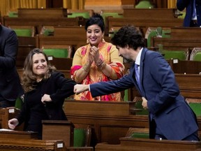 Finance Minister Chrystia Freeland receives a fist-bump from Prime Minister Justin Trudeau after unveiling her first fiscal update, the Fall Economic Statement 2020, in the House of Commons, in Ottawa, on Monday, Nov. 30, 2020.