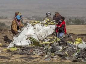 In this March 11, 2019, file photo, rescuers work at the scene of an Ethiopian Airlines flight crash outside of Addis Ababa, Ethiopia.