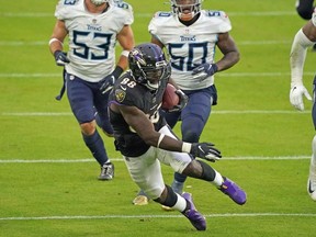 Nov 22, 2020; Baltimore, Maryland, USA; Baltimore Ravens wide receiver Dez Bryant (88) gains fourth quarter yardage following a catch against the Tennessee Titans at M&T Bank Stadium.