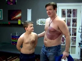 Alberta dad, Derek Prue Sr., shows off his tattoo next to his son.