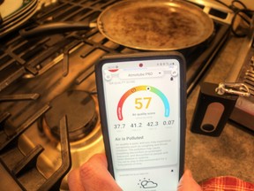 The Atmotube unit seen here with instant phone readout showing poor air quality after cooking griddle cakes on the stove.