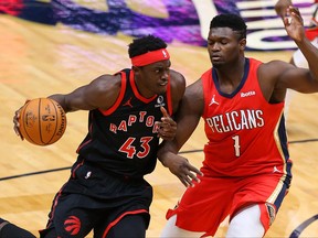 Raptors’ Pascal Siakam drives to the hoop against the Pelican’ Zion Williamson on Saturday night.