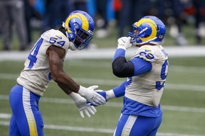 Los Angeles Rams defensive end Aaron Donald (right) celebrates with outside linebacker Leonard Floyd last week.