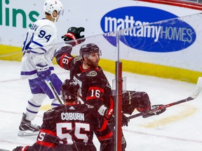 Senators winger Austin Watson (16) celebrates his goal with teammate Braydon Coburn on Friday night.