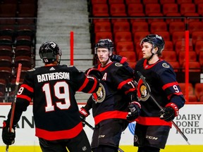 Ottawa Senators defenseman Thomas Chabot (middle), Drake Batherson (left), and Josh Norris celebrate a first period goal against the Toronto Maple Leafs on Friday