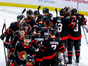 A happy bunch of Senators players celebrate Friday's 5-3 win against the Maple Leafs.