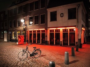 A photo shows an empty street in the centre of Amsterdam, on January 18, 2021 amid the Covid-19 pandemic.