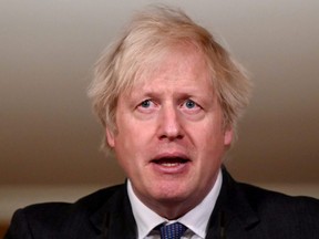 British Prime Minister Boris Johnson attends a coronavirus news conference at 10 Downing Street, London, Friday, Jan. 22, 2021.