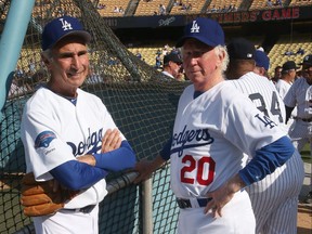 Former Los Angeles Dodgers Sandy Koufax, left, and Don Sutton talk as they gather with former the New York Yankees for an Old Timers game before the game between the Atlanta Braves and the Los Angeles Dodgers at Dodger Stadium on June 8, 2013 in Los Angeles, Calif.