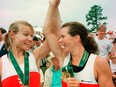 Kathleen Heddle (left) and partner Marnie McBean celebrate their gold medals at the Atlanta Games.