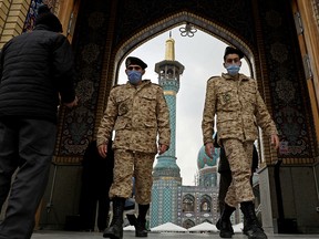 Iranian soldiers leave Imamzadeh Saleh shrine after Tehran reopened following a two-week shutdown, December 5, 2020.