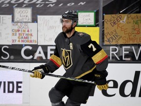 Alex Pietrangelo of the Vegas Golden Knights warms up in front of homemade signs posted on the glass before a game against the Anaheim Ducks at T-Mobile Arena on Jan. 14, 2021 in Las Vegas.