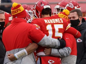 Quarterback Patrick Mahomes of the Kansas City Chiefs is assisted off the field after an injury from a sack that would remove Mahomes in the third quarter of the AFC Divisional Playoff game against the Cleveland Browns at Arrowhead Stadium on Jan. 17, 2021.