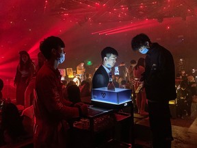 In this picture taken on January 20, 2021, people visit a nightclub in Wuhan, China's central Hubei province.