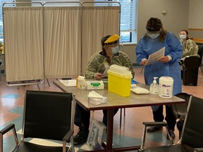 Eastern Ontario Health Unit staffers and Cornwall-SDG paramedics at the Parisien Manor long-term care centre's COVID-19 vaccine clinic, on Wednesday, Jan. 13, 2021.