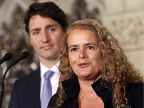 Prime Minister Justin Trudeau looks on as Julie Payette speaks in July 2017.