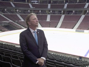 Ottawa Senators owner Eugene Melnyk stands near the ice at the Canadian Tire Centre in Ottawa on September 7, 2017.