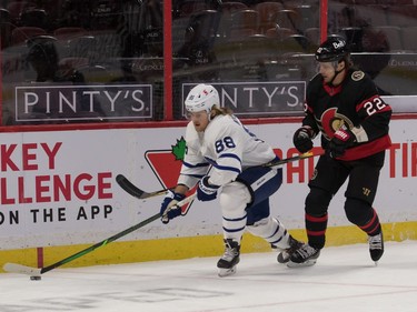 Maple Leafs right-winger William Nylander (88) skates with the puck in front of Senators defenceman Nikita Zaitsev (22) in the first period.