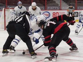 Maple Leafs centre Jason Spezza faces off against Senators left-winger Brady Tkatchuk  in the second period.