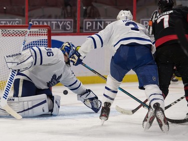 A shot by Senators left-winger Brady Tkatchuk (7) tips off the glove of Maple Leafs netminder Jack Campbell and bounces into the corner in the second period.