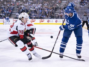 File photo/ Feb 1, 2020. Toronto Maple Leafs center John Tavares (91) battles for a puck with Ottawa Senators defenseman Thomas Chabot (72) during the first period at the Scotiabank Arena.