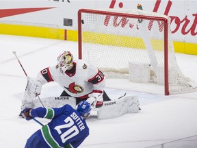 Canucks forward Brandon Sutter scores one of his three goals against Senators netminder Matt Murray in the second period of Monday's game at Vancouver.