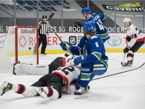 Vancouver Canucks forward Elias Pettersson (40) scores on Ottawa Senators goalie Matt Murray (30) in the first period at Rogers Arena.