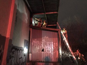 Firefighters extinguish a fire in an Industrial Avenue warehouse on Tuesday.