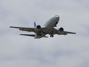 FILES: A plane approaches a runway at the Ottawa airport in June 2020.