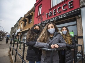 Sabrina Lorefice (from left) and her sisters Lucy and Adriana, in front of their family restaurant, Trecce, located at 1792 Danforth Ave., east of Coxwell Ave. in Toronto, Ont. The sisters held down a suspect who allegedly broke into their family-owned restaurant on Tuesday around 3:30 a.m., until police arrived.