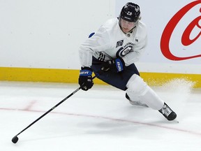 Patrik Laine hits the brakes after leaving the puck behind during Winnipeg Jets practice at Bell MTS Place on Wed., Jan. 13, 2021.