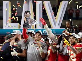 Kansas City Chiefs' Patrick Mahomes celebrates with the Vince Lombardi trophy after winning Super Bowl LIV.