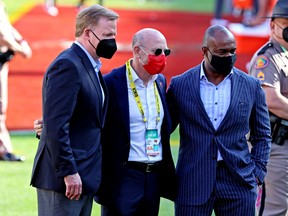 Left to right: NFL commissioner Roger Goodell, Tampa Bay Buccaneers owner Malcolm Glazer and NFLPA executive director DeMaurice Smith speak before Super Bowl LV.