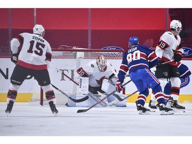 Senators goaltender Matt Murray makes a pad save near Tomas Tatar of the Canadiens in the first period.