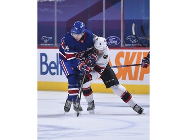 Nick Suzuki of the Canadiens and Josh Norris of the Senators skate against each other during the first period.