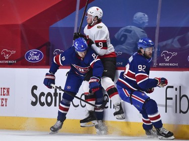 Ben Chiarot of the Canadiens checks Josh Norris of the Senators during the second period of Thursday's game.