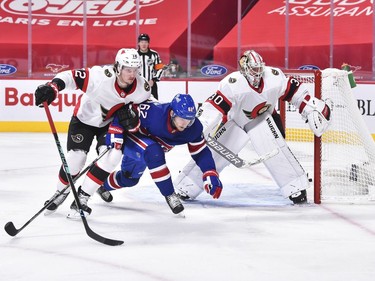 Thomas Chabot of the Senators and Artturi Lehkonen of the Canadiens battle for position in front of goaltender Matt Murray during the second period.