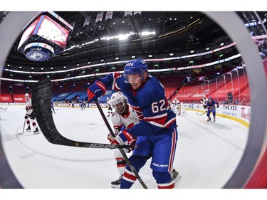 Artturi Lehkonen of the Canadiens skates against Colin White of the Senators during the second period.