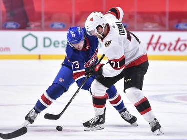 Tyler Toffoli of the Canadiens and Chris Tierney of the Senators take a face-off during the second period.