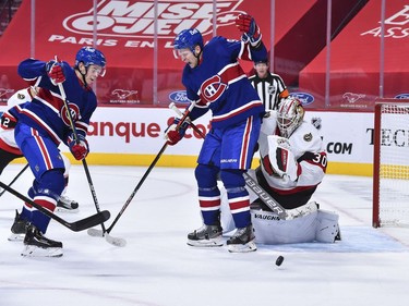 Corey Perry of the Canadiens flinches as a shot hits his left hand as he tries to screen Senators goaltender Matt Murray during the second period.