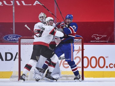 Senators goaltender Matt Murray stands tall to look past the traffic created by teammate Erik Gudbranson and Corey Perry of the Canadiens in the third period.