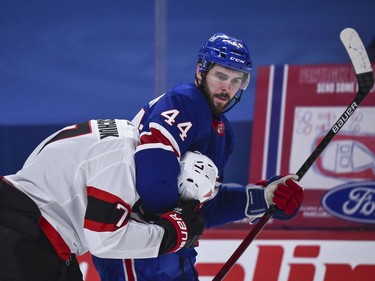 Canadiens defenceman Joel Edmundson puts Senators left-winger Brady Tkachuk in a headlock during a third-period tussle.