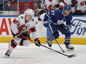 Tim Stuetzle of the Ottawa Senators skates with the puck against Pierre Engvall of the Toronto Maple Leafs at Scotiabank Arena on Feb. 15, 2021 in Toronto.