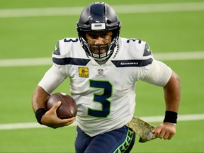 Quarterback Russell Wilson isn’t happy with how many times he has been hit since he became a Seahawk.