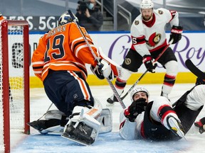Edmonton Oilers' goaltender Mikko Koskinen (19) battles Ottawa Senators' Drake Batherson (19) during second period NHL action at Rogers Place in Edmonton, on Tuesday, Feb. 2, 2021.