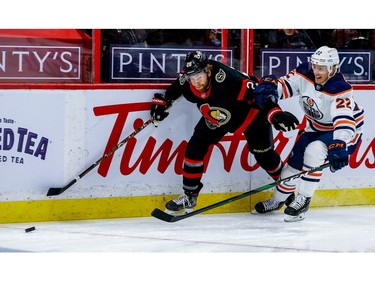 Senators right-winger Connor Brown eludes the check of Oilers defenceman Tyson Barrie in the first period of Tuesday's game.