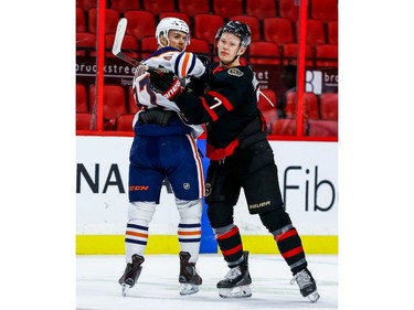 Senators left-winger Brady Tkachuk checks Oilers centre Connor McDavid in the first period.
