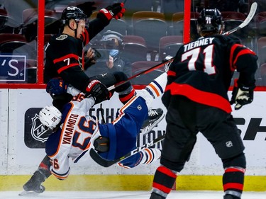 Senators left-winger Brady Tkachuk delivers a huge bodycheck on Oilers right-winger Kailer Yamamoto in the second period.