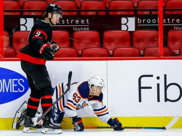 Senators centre Josh Norris bears the guilty look of a player who is about to be penalized for tripping the Oilers' Tyler Ennis in the third period on Tuesday night.
