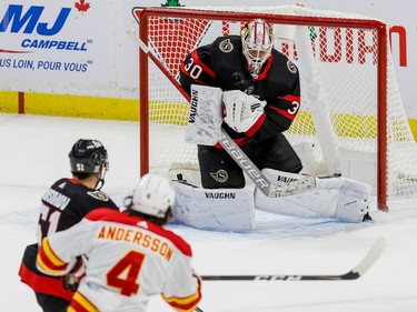 Ottawa Senators goaltender Matt Murray  makes a save off of Calgary Flames defenceman Rasmus Andersson during first period action at the Canadian Tire Centre on Thursday.